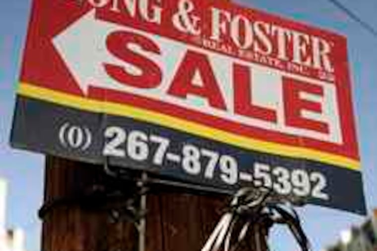 A sign advertises a home for sale in Philadelphia. An upbeat report on national sales helped the Dow to a 13-month high. Story, C4.