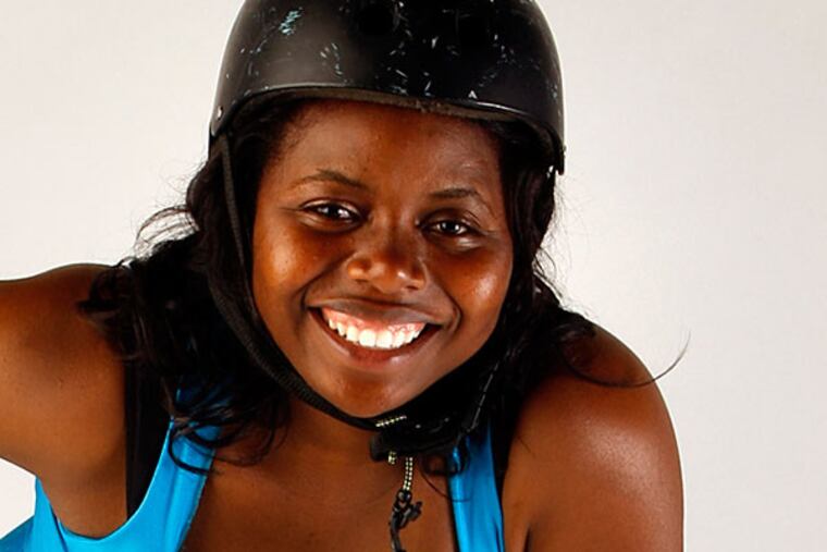 Danecia Berrian, in her roller derby gear, is a 4th-grade teacher. STEVEN M. FALK / STAFF PHOTOGRAPHER