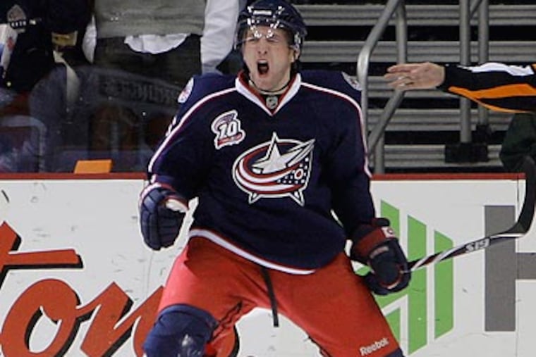 Columbus center Kyle Wilson celebrates after scoring a goal during the first period. (Jay LaPrete/AP)