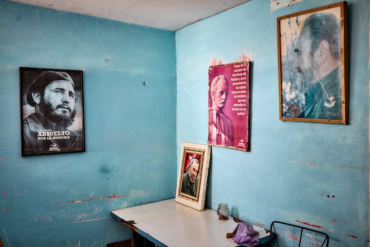 Posters depicting Fidel Castro in an office in one of the towers at a residential complex of five 18-story buildings in Santiago de Cuba on May 14, 2026. The elevator no longer functions most of the time. (Lisette Poole González/The New York Times).