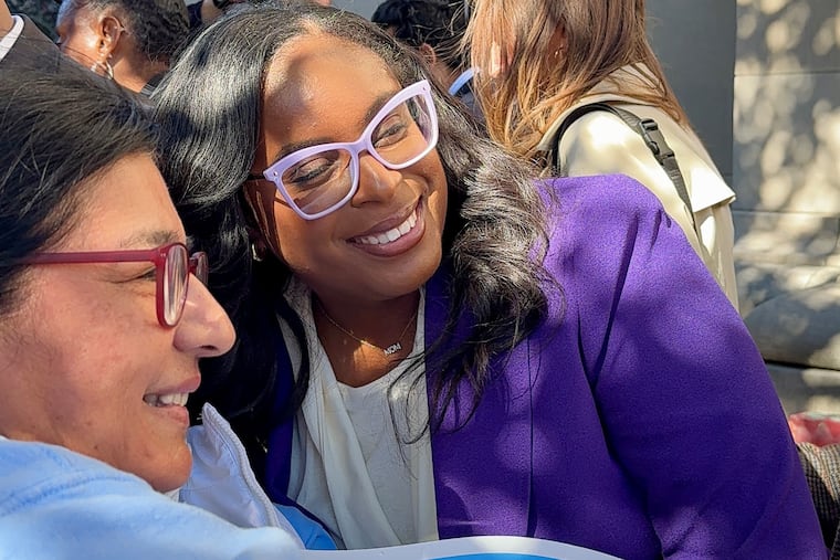 McIver with a supporter in November outside the courthouse where her lawyers argued to toss the case.