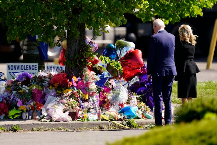 President Joe Biden and first lady Jill Biden visit the scene of a shooting at a supermarket to pay respects and speak to families of the victims of Saturday's shooting in Buffalo, N.Y.