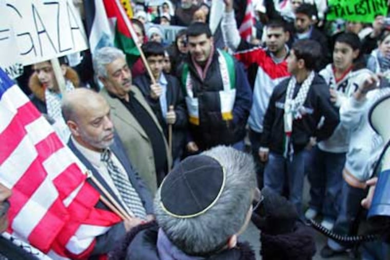 Rabbi Linda Holtzman speaks to protesters last week during a rally against the Israeli attack on the Gaza Strip. (David Swanson / Staff Photographer)