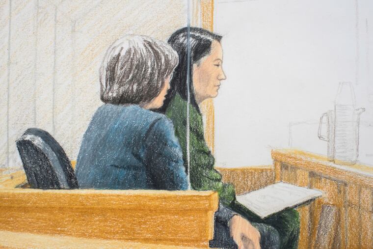 In this courtroom sketch, Meng Wanzhou, right, the chief financial officer of Huawei Technologies, sits beside a translator during a bail hearing at British Columbia Supreme Court in Vancouver, on Friday, Dec. 7, 2018. Meng faces extradition to the U.S. on charges of trying to evade U.S. sanctions on Iran. She appeared in a Vancouver court Friday to seek bail. (Jane Wolsak/The Canadian Press via AP)
