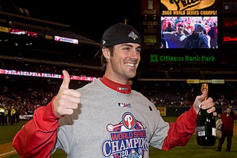 Cole Hamels celebrates after the Phillies won Game 5 to clinch the World Series. Hames and the Phils just agreed to the three-year contract. (AP Photo/Chris O'Meara)