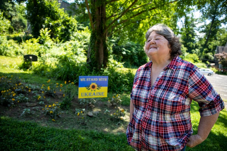 Janet Haas, member at The Unitarian Society of Germantown, talks about the creation and meaning of the sunflower garden, in Philadelphia, Pa., on June 4, 2022.