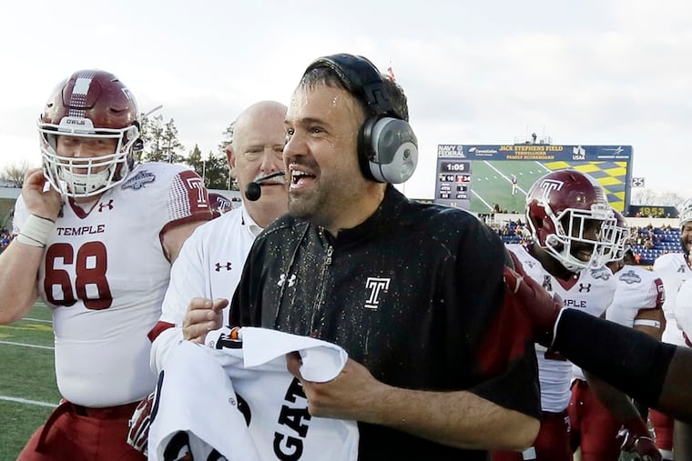 Temple head coach Matt Rhule has the water cooler dumped on him at the end of the Temple vs. Navy AAC Championship football game at Navy–Marine Corps Memorial Stadium in Annapolis, Md. on December 3, 2016. Temple won the AAC Championship 34-10.