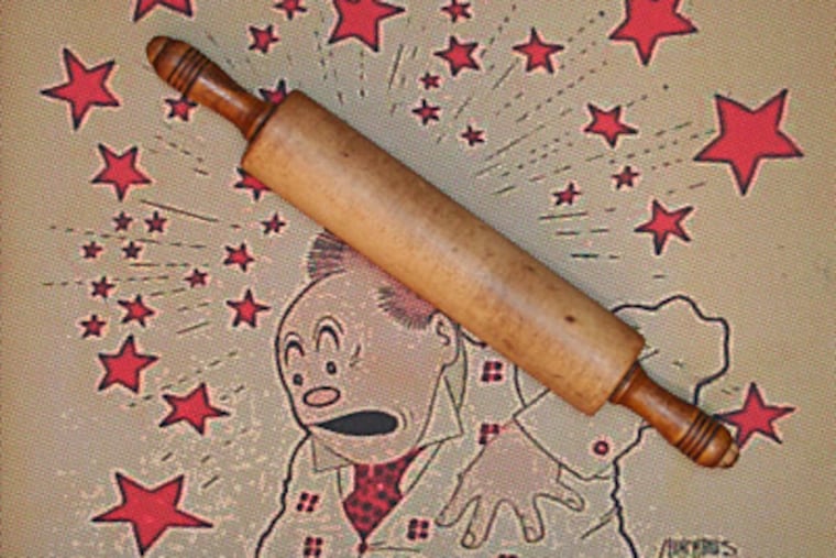 Detail from "Battle Ax" (2007), digital print, wood, by Tom Cohen, at Ursinus College. Five of the 27 artists in the "Distaff Toolkit" exhibition are men.