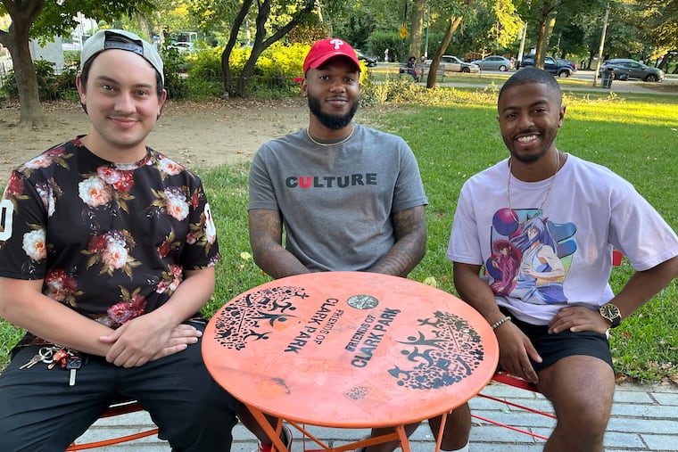 Producer Mikey Campbell (left) sits with podcast hosts Matt Portter (middle) and Travis Valentine in Clark Park. The three created DB4L, a podcast following the Dragon Ball Super manga.