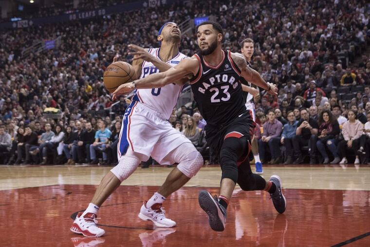 Raptors’ Fred VanVleet guard, right, steals the ball from Sixers’ guard Jerryd Bayless during first half NBA basketball action in Toronto on Saturday, Dec. 23, 2017.