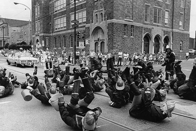 Strutters dressed as firemen entertained crowds along the parade route in 1973. (TEMPLE URBAN ARCHIVES)