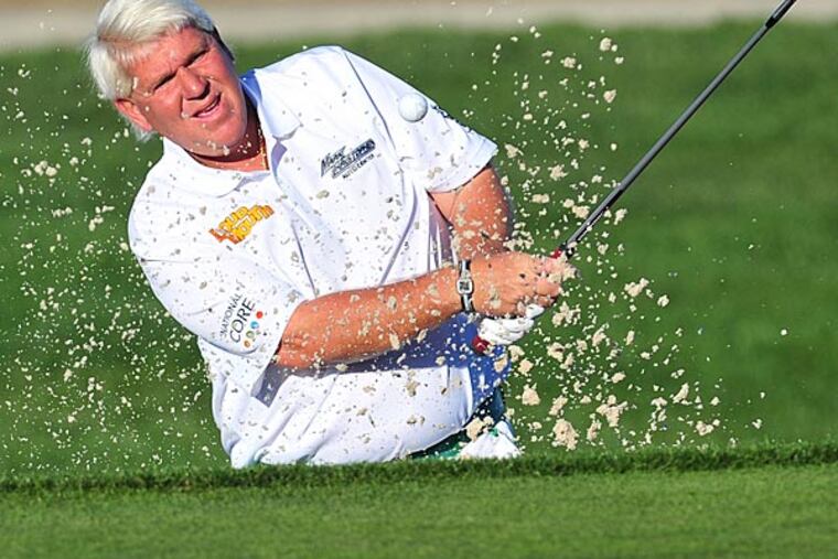 John Daly hits from a sand trap on the twelfth course during the second round at Monterey Peninsula Country Club. (Gary A. Vasquez/USA Today)