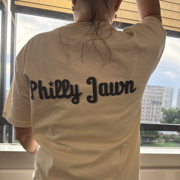 The back of Sheila Bridges X COMOCO T-shirts inspired by iconic Philadelphia food. The shirts are part of a limited-edition collaboration between interior designer Sheila Bridges and Stephen Satterfield, best known for the Netfix documentary on African American food, "High on the Hog."