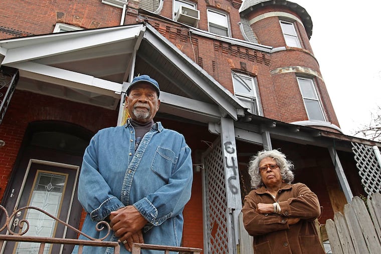 Howard Williams and Virginia Brooker live two doors down from the decrepit property on 32nd Street. ( Michael Bryant / Staff Photographer )