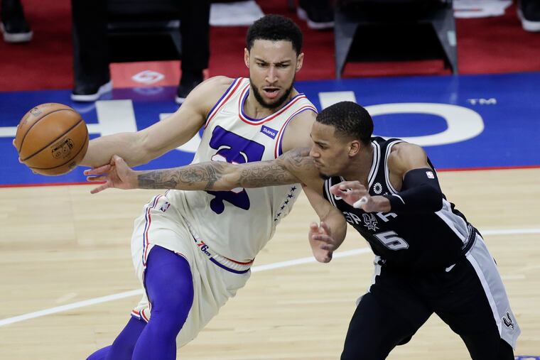 Sixers guard Ben Simmons (left) has helped carry the load in Joel Embiid's absence.
