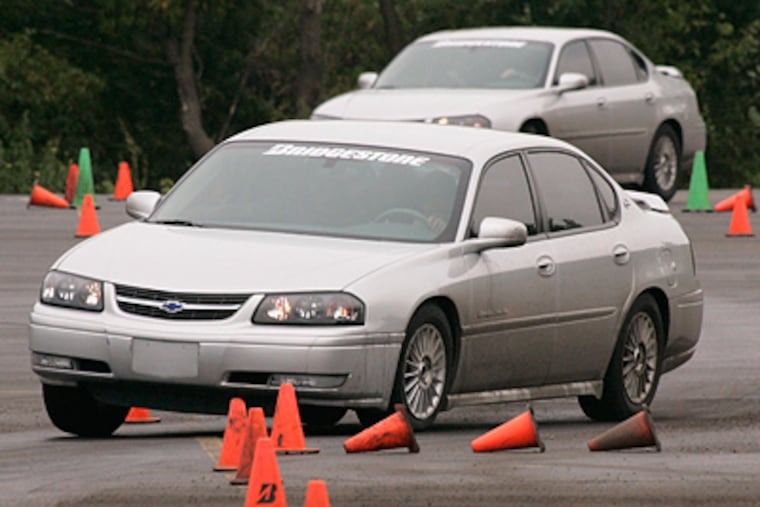 In the Driver's Edge program, teens learn how to react behind the wheel in real emergency situations as instructors simulate rapid lane changes, emergency braking and spin-outs. (AP Photo/Brian Kersey)