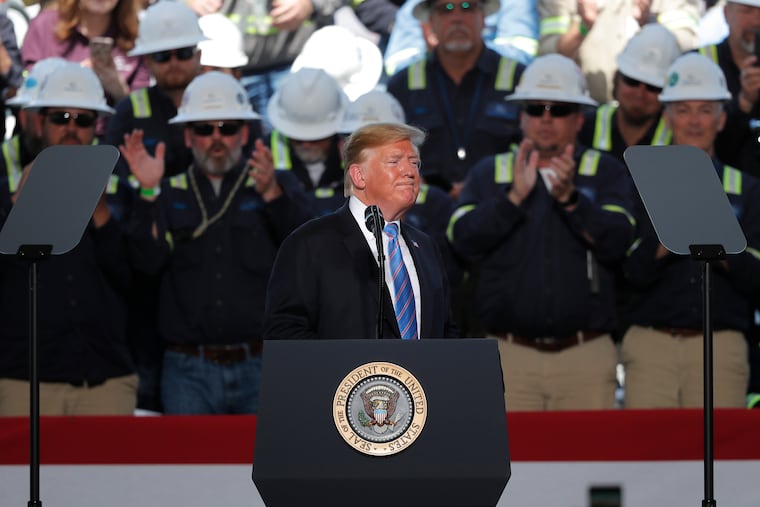 Workers applaud as President Donald Trump speaks at the Cameron LNG Export Terminal in Hackberry, La., Tuesday, May 14, 2019.