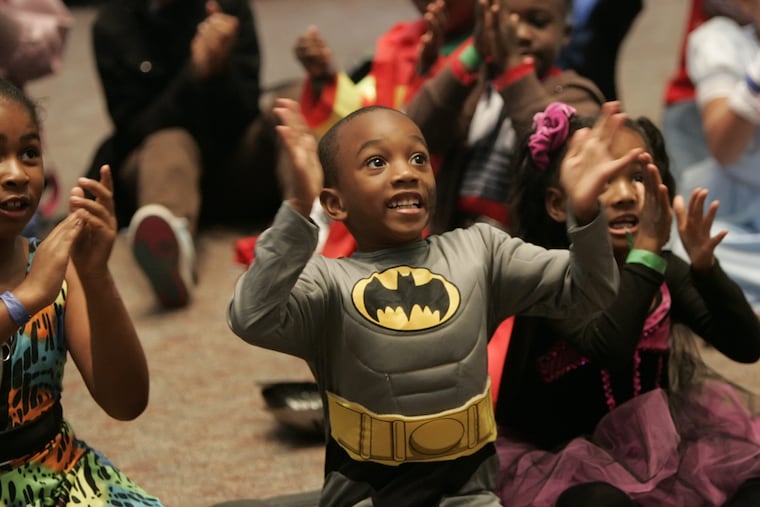 In this file photo, a 6-year-old Batman celebrates Halloween.