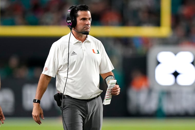 Miami head coach Manny Diaz watches during the first half of an NCAA college football game against Virginia Tech, Saturday, Nov. 20, 2021, in Miami Gardens, Fla. (AP Photo/Lynne Sladky)