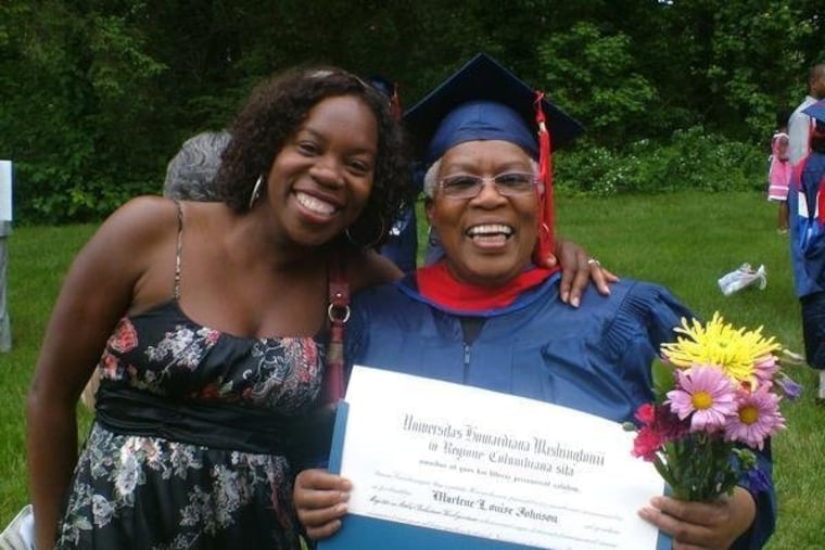 In this undated photo made available by Morenike Evans, Morenike Joela Evans (left) and her mother, Marlene Johnson, pose during Johnson's Howard University graduation with a master's degree in religious studies in Washington.