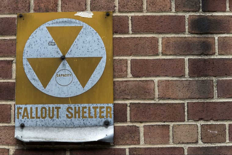 In this Tuesday, Jan. 16, 2018 photo, a fallout shelter sign hangs on a building on East 9th Street in New York. The fallout shelters, marked with metal signs featuring the symbol for radiation — three joined triangles inside a circle — were set up in tens of thousands of buildings nationwide in the early 1960s amid the nuclear arms race. In New York City alone there were believed to be about 18,000.