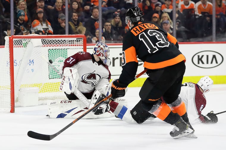 Flyers center Kevin Hayes scores a third-period shorthanded goal past Colorado goaltender Philipp Grubauer and defenseman Cale Makar on Feb. 1.