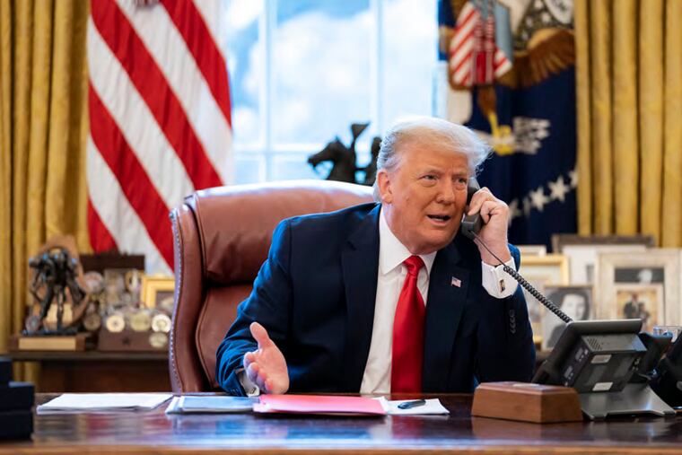 Former President Donald Trump talks on the phone to Vice President Mike Pence from the Oval Office of the White House on the morning of Jan. 6, 2021.