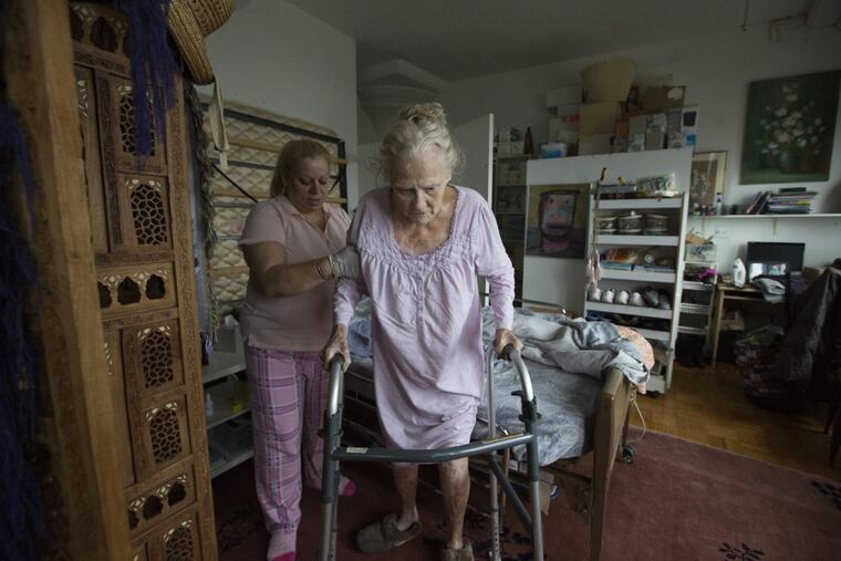 Vilma Rozen helps her client, Dee, in the documentary “Care.”