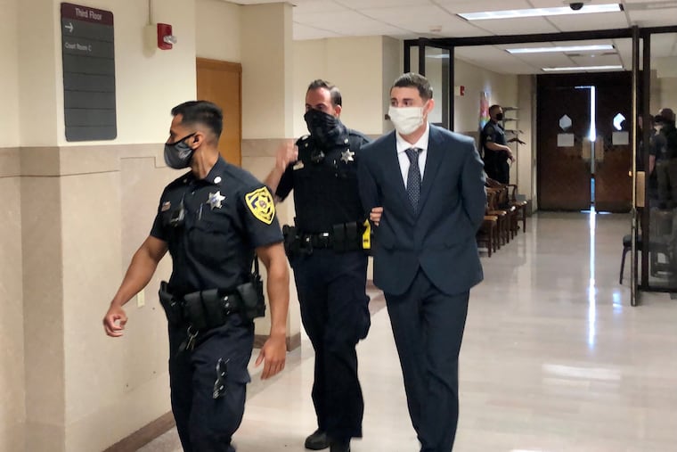 Gilbert Newton III is escorted out of a courtroom in the Montgomery County Courthouse. Newton was convicted of first-degree murder in the killing of his ex-girlfriend, Morgan McCaffery, during an argument in July 2020.