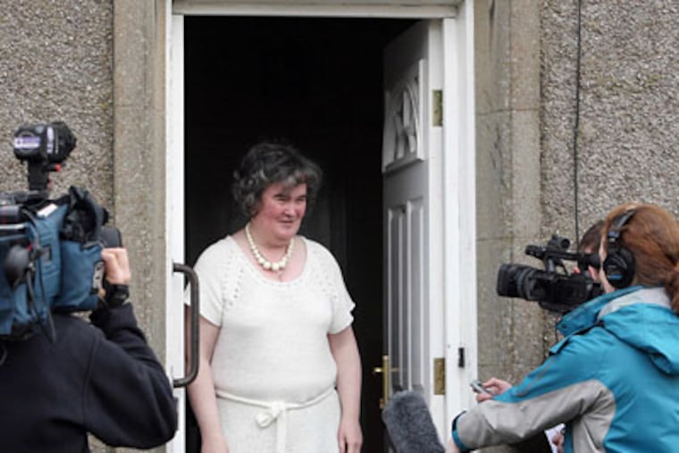 Susan Boyle, whose performance on the television show "Britain's Got Talent" wowed the judges, faces the media at her home in Blackburn, Scotland.(AP Photo/Andrew Milligan-pa)