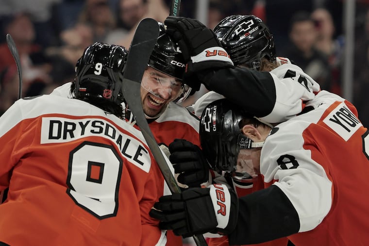 Flyers Noah Cates and Cam York celebrate Jamie Drysdale’s (left) goal that gave them a 3-1 lead in the third period.