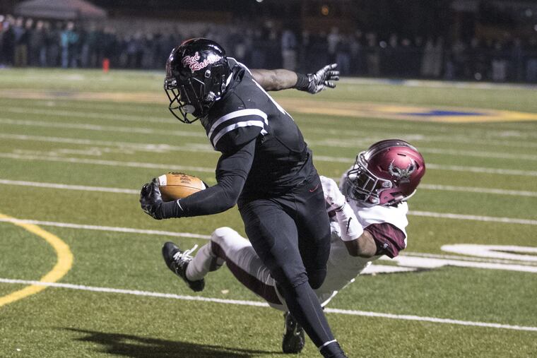 Coatesville's Aaron Young, left, breaks away from a St. Joseph's Prep defender in last year's PIAA Class 6A semifinal playoff.