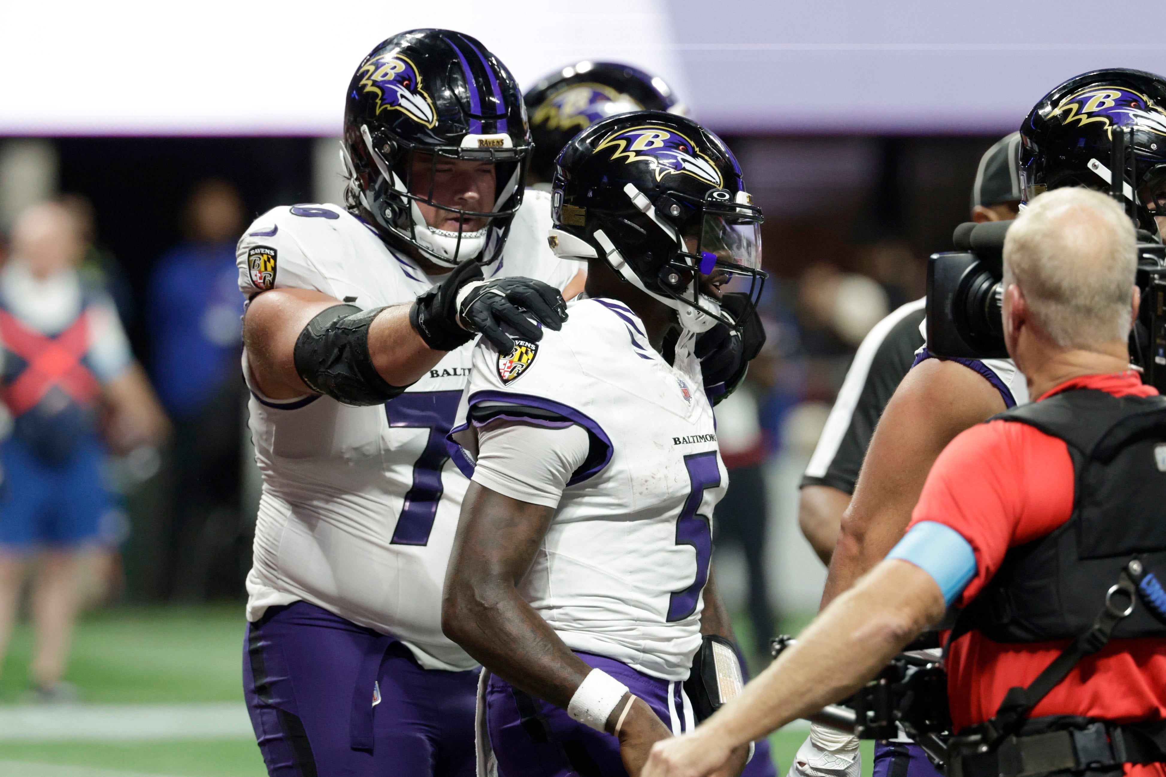 Huntley leads late TD drive to force OT and then scores on 1-yard run as Ravens beat Falcons 30-23