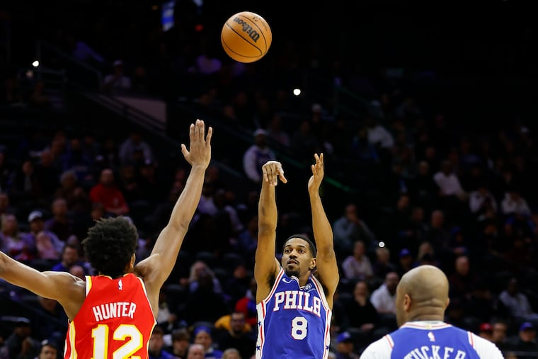 Sixers guard De'Anthony Melton shoots the basketball over Atlanta Hawks forward De'Andre Hunter on Monday in Philadelphia.