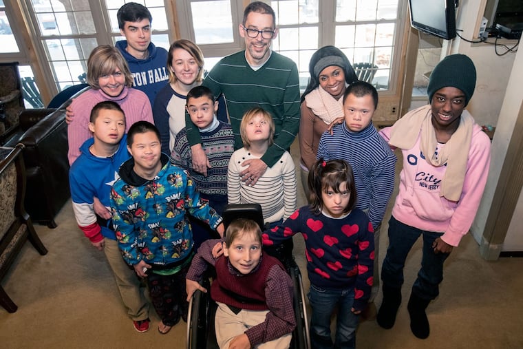 Adam (top center), and Amy (left), Boroughs with 11 of their 12 children, their oldest off at college. Meet the Adam and Amy Boroughs of Logan Township, who have adopted a dozen special needs kids from across the globe. The Boroughs are devout Christians and have adopted a dozen kids, many with developmental disabilities, from four continents.