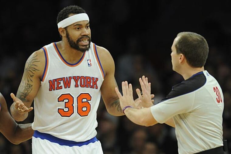 New York Knicks' Rasheed Wallace, left, argues with referee John Goble
after being given a technical foul in the first quarter of the NBA
basketball game against the Phoenix Suns in New York, Sunday, Dec. 2,
2012. Wallace was given a second technical and ejected from the game.
(AP Photo/Henny Ray Abrams)