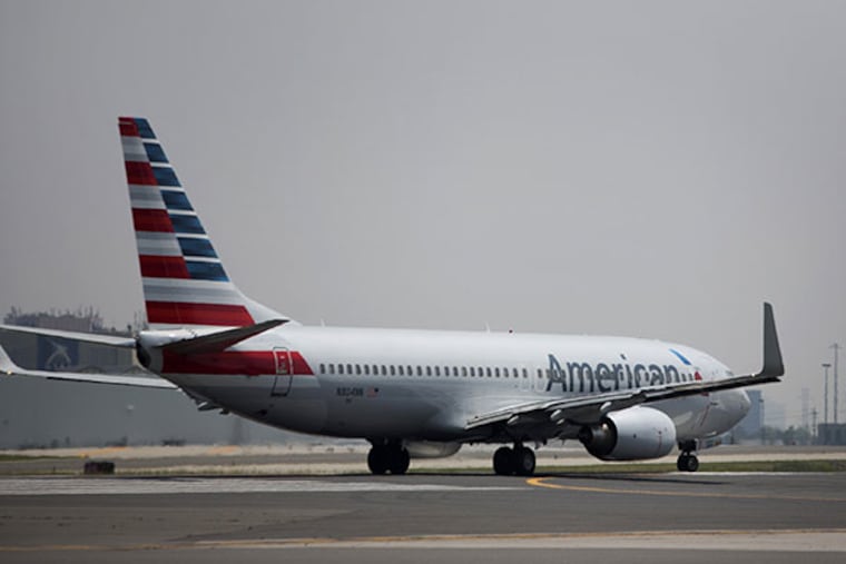 An American Airlines Inc. aircraft taxis at Toronto Pearson International Airport in Toronto, Ontario, Canada, on Wednesday, July 3, 2013. (Brent Lewin/Bloomberg)
