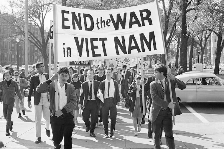 College students from various nearby schools march down Commonwealth Avenue in Boston in 1965 to attend a rally protesting U.S. involvement in Vietnam.