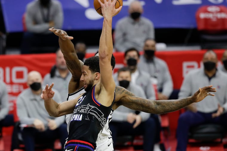 Sixers guard Ben Simmons passes the ball over Brooklyn Nets center DeAndre Jordan on Saturday, February 6, 2021 in Philadelphia.