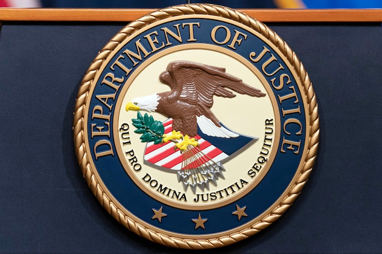 The Department of Justice seal.