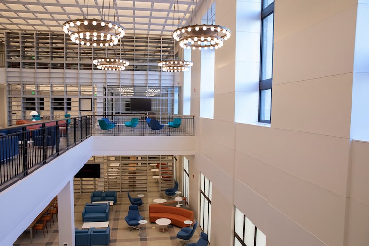 Four levels of reading rooms, event spaces, offices and book storage now occupy the part of the Free Library where its book stacks once stood.