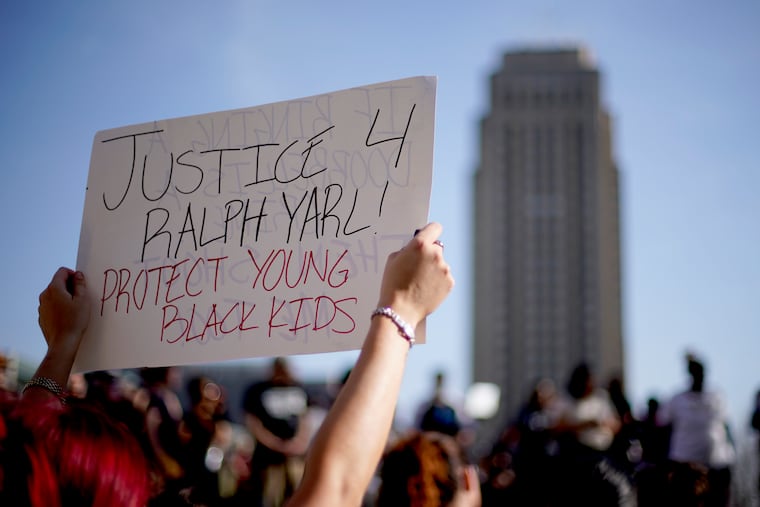People gather at a rally to support Ralph Yarl while city hall stands in the distance, Tuesday, April 18, 2023, in Kansas City, Mo. Yarl, a Black teenager, was shot last week by an 84-year-old white homeowner when he mistakenly went to the wrong address to pick up his younger brothers.