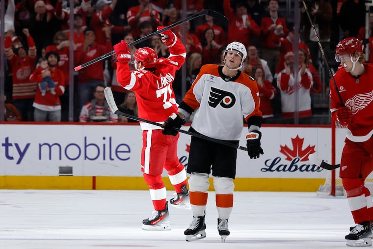 Detroit Red Wings center Dylan Larkin celebrates one of his three goals against the Flyers on Thursday.