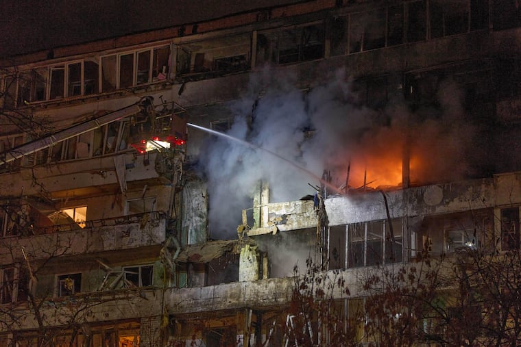 Firefighters in Kyiv, Ukraine, put out a fire after a drone hit a multi-storey residential building during a Russian attack on Tuesday, Nov. 25.