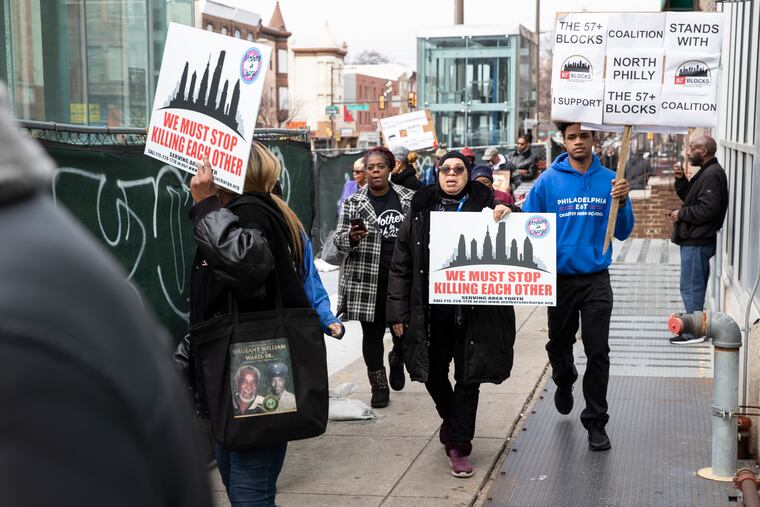 (center) Charlene Onugha, from Mothers in Charge, marches on North Broad Street.