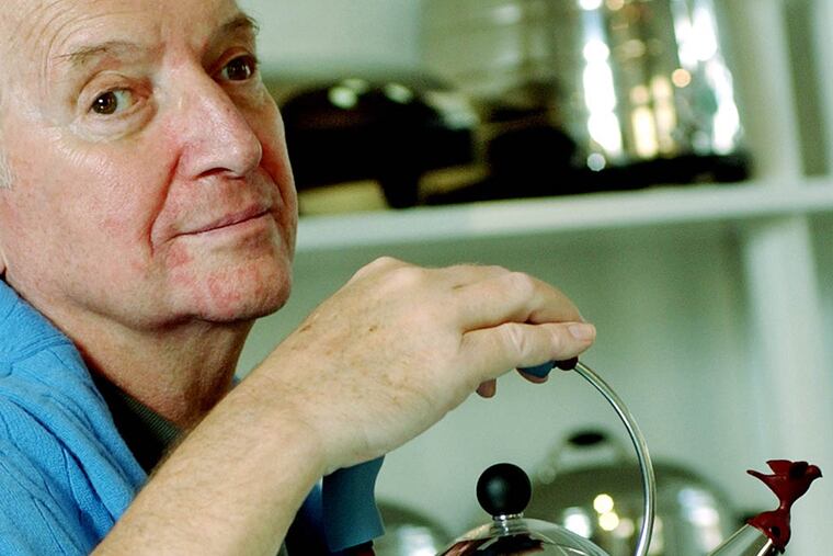 In this Oct. 21, 2003, file photo, architect and designer Michael Graves poses with a teapot he designed at his studio in Princeton, N.J. ( Daniel Hulshizer / AP Photo file )