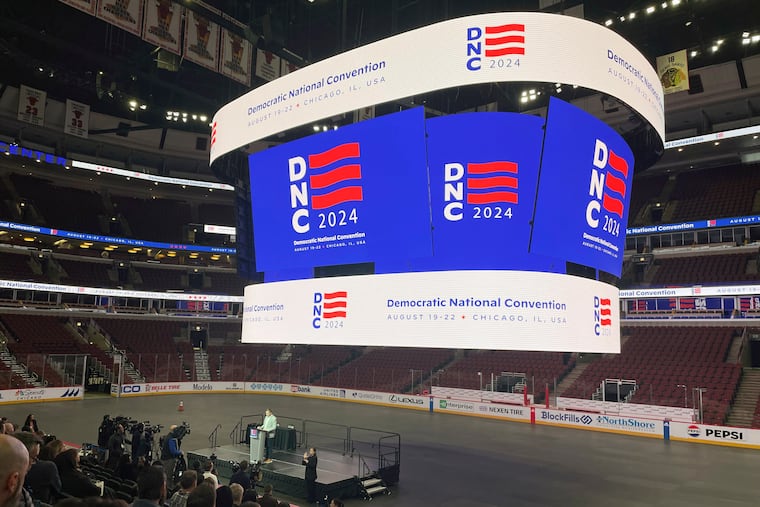 Media attend a Democratic National Convention walk-through at the United Center in Chicago on Jan. 18, 2024. After a year of planning for just the right event, organizers of the DNC are suddenly gaming out how to showcase a new headliner, a new No. 2, and a commander in chief who’s being shifted to a more peripheral position.