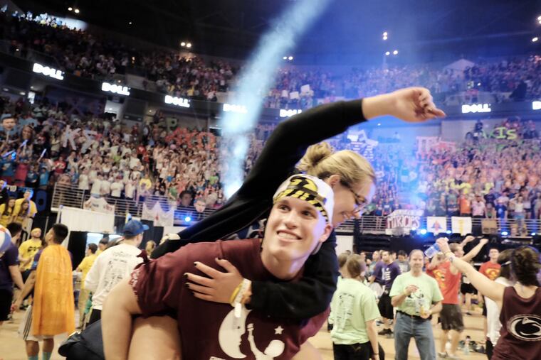 File: Sarah Wartman gets a break as she is carried across the floor by special events captain Carl Nerthling.