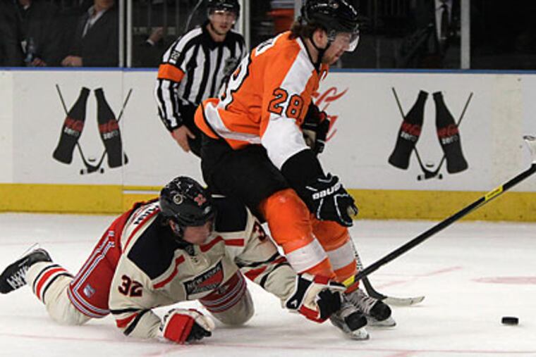 The Flyers are five points back of New York, and after this weekend the Rangers have two games in-hand. (Kathy Willens/AP)
