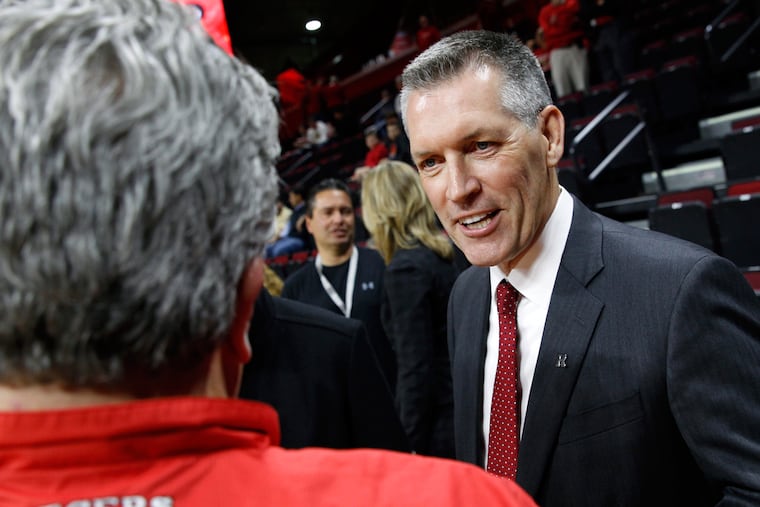 Rutgers new athletic director Patrick Hobbs, Dean Emeritus of the Seton Hall University School of Law, greets a Rutgers fan before an NCAA college basketball game against Wake Forest, Monday, Nov. 30, 2015, in Piscataway, N.J.